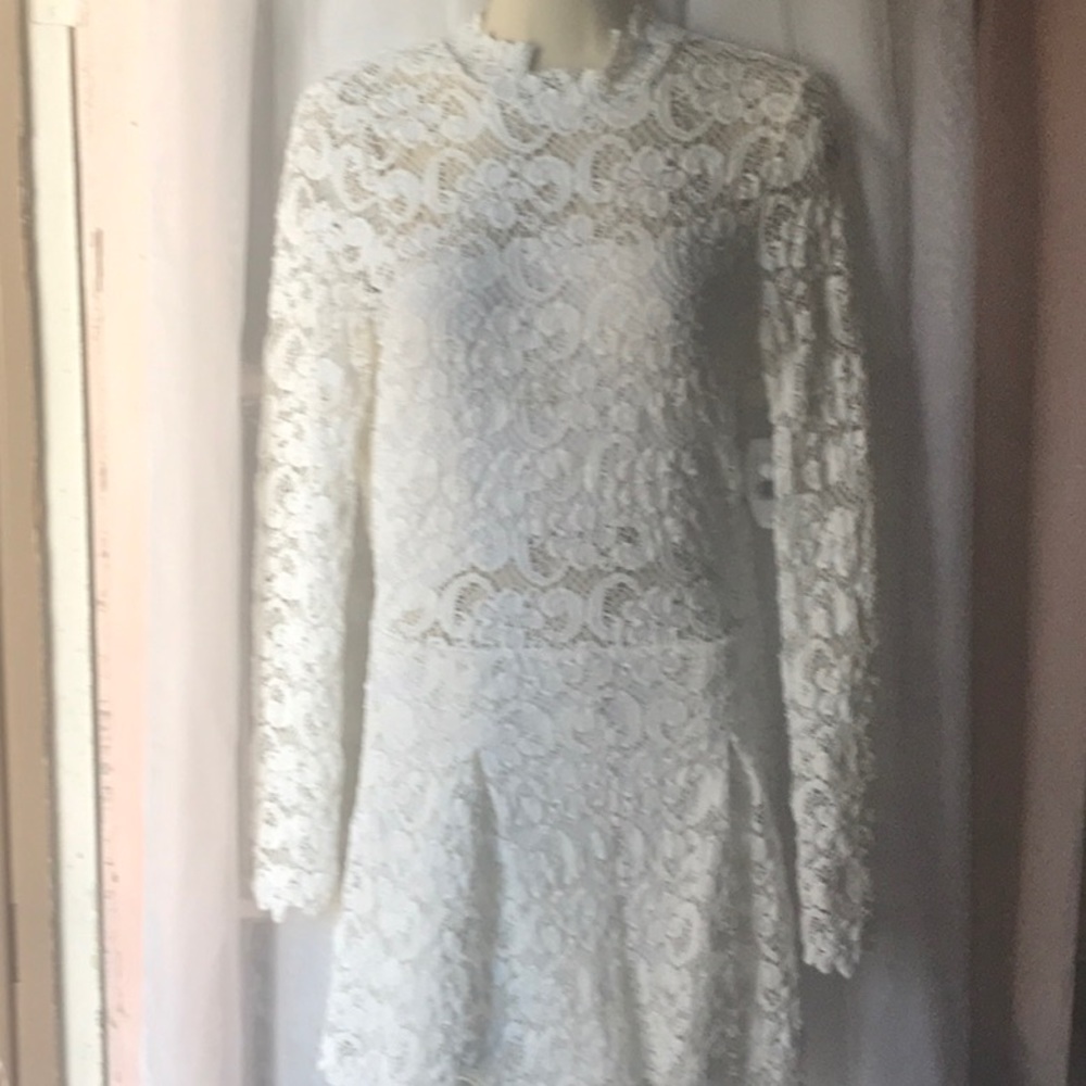 A dress/romper white lace, open back, lined shorts